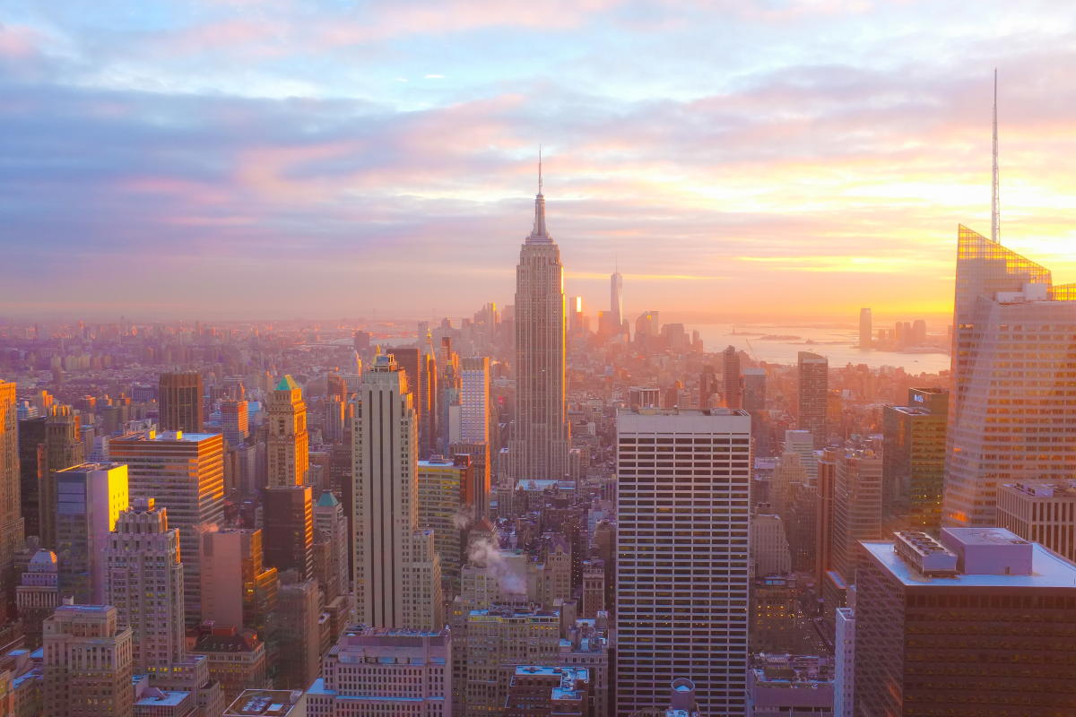 Sunset of the Manhattan Skyline centered around the Empire State Building.