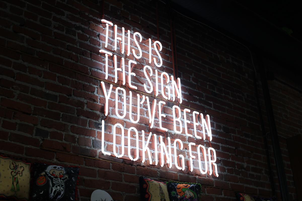 Photo of a neon sign with the text 'This is the sign you have been looking for' 